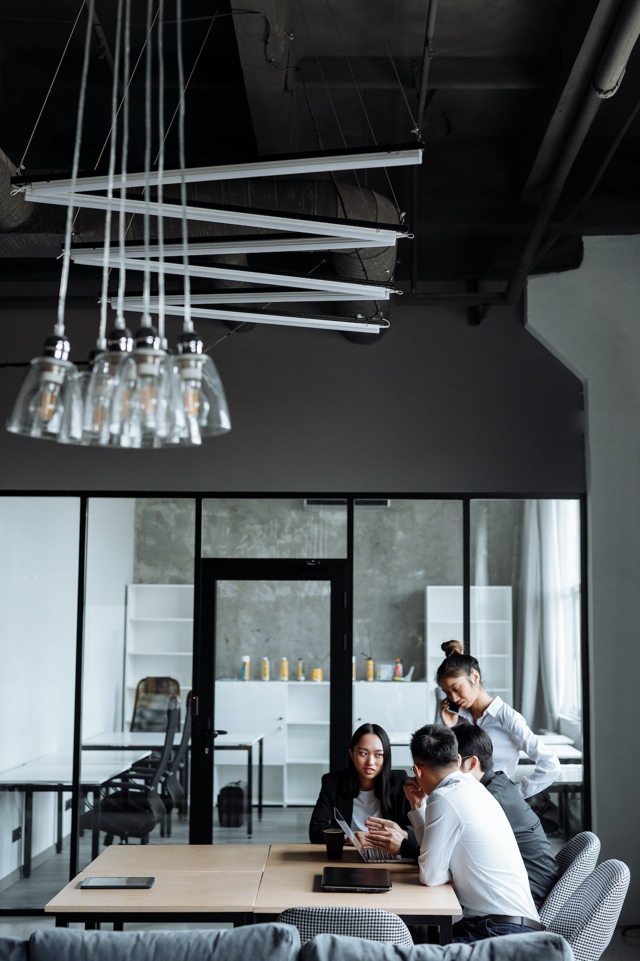 people around a table in modern office